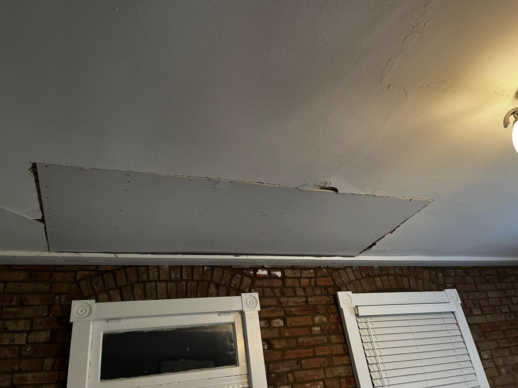 A ceiling with a large section of sagging drywall needing repair by Better Than Your Last Handyman in St. Charles, MO.
