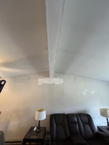 A ceiling and wall showing fresh drywall repair work in progress by Nick's Handyman Services in Martinsburg, WV.