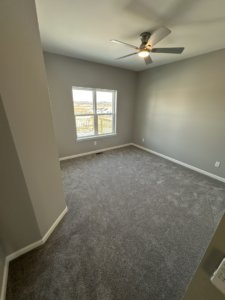 A newly installed ceiling fan in a room by Harpe Development LLC in Kenosha, WI.
