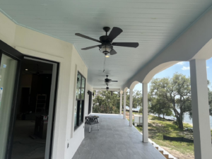 Newly installed ceiling fans on an outdoor porch by BGI Electric in Pensacola, FL