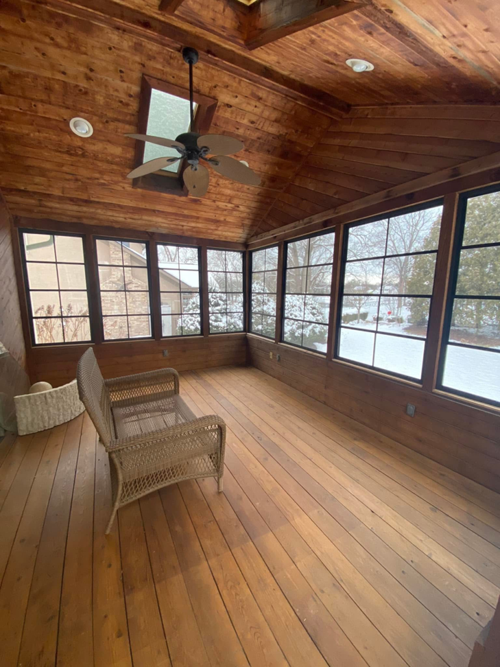 A newly installed ceiling fan in a sunroom with wooden walls and ceiling by Sunspace of Central Ohio in Columbus, OH.