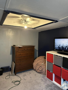 A bedroom featuring a newly installed ceiling fan and light fixture by T-N-T Mechanical in Westland, MI.