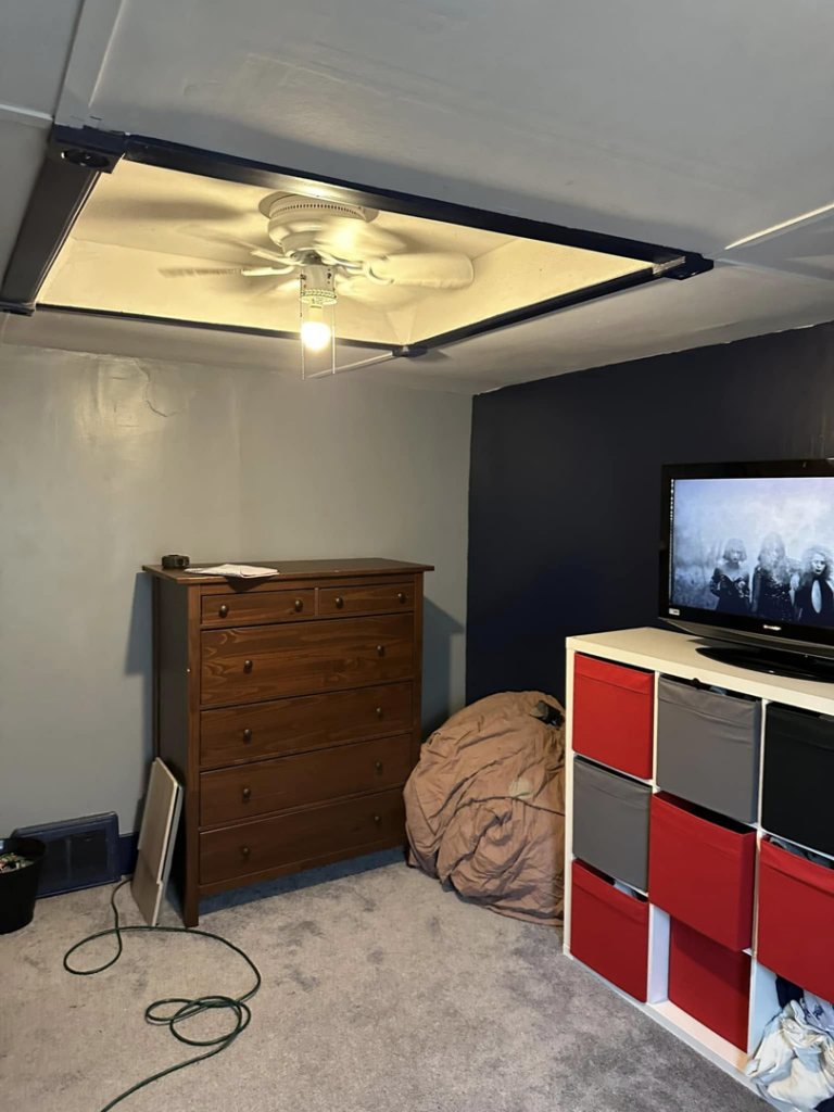 A bedroom featuring a newly installed ceiling fan and light fixture by T-N-T Mechanical in Westland, MI.