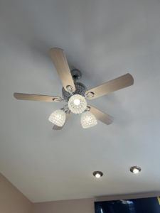 A ceiling fan with crystal light fixtures and recessed lighting installed by GOAT Tv Mounting & Home Improvement L.L.C in Toledo, OH.