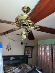 Ceiling fan with light kit removed and exposed wires, ready for repair by Green Man's Contracting & Landscaping LLC in West Hartford, CT.