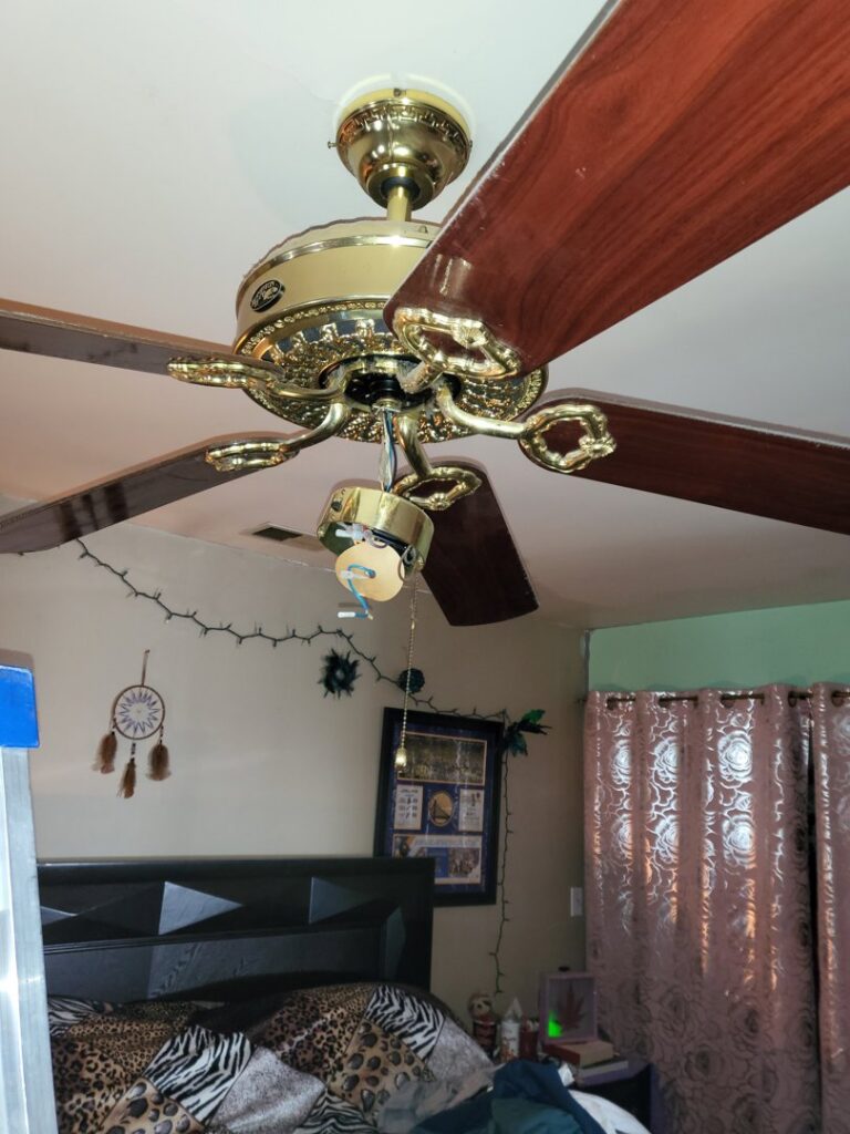 Ceiling fan with light kit removed and exposed wires, ready for repair by Green Man's Contracting & Landscaping LLC in West Hartford, CT.