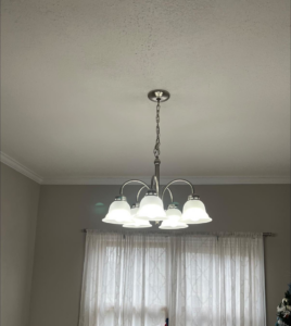 A newly installed ceiling light fixture in a home by Task Tacklers Handyman Services in Olathe, KS.