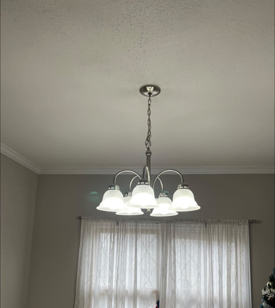 A newly installed ceiling light fixture in a home by Task Tacklers Handyman Services in Olathe, KS.