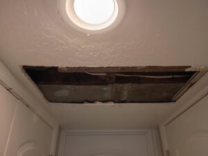 Ceiling repair in progress showing exposed framing and ductwork by Handyman house repairs and remodeling in Provo, UT