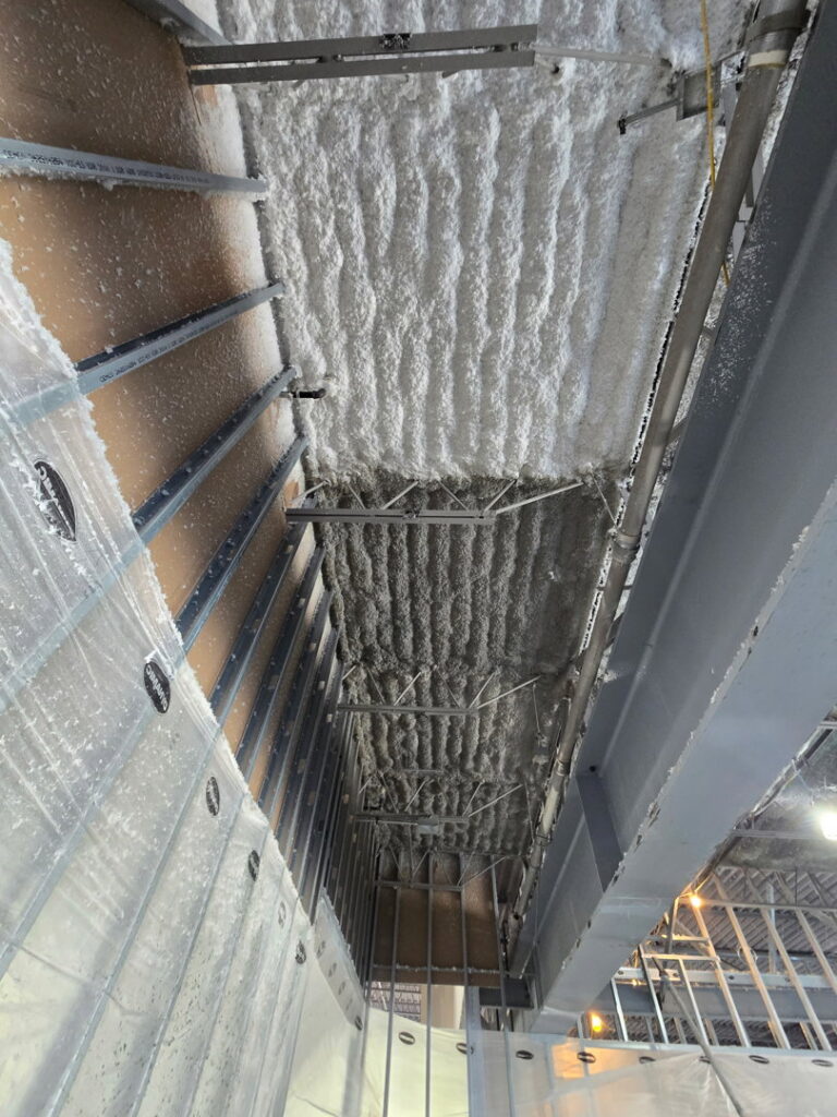 A ceiling spray foam insulation project in progress by Bell SPI - Shamrock Painting in Denver, CO.