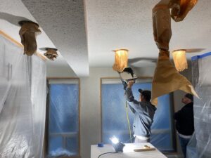 Ceiling texture application and painting preparation by Precision Coatings LLC Siding and Painting Specialist in Tacoma, WA.