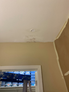 A ceiling showing water damage and a hole, indicating a repair job by McCarran Handyman Services in Boulder City, NV.