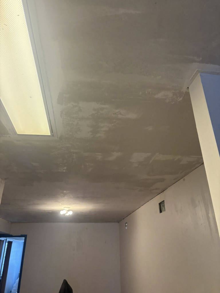 A ceiling with drywall compound applied, showcasing ceiling repair and finishing services by Byrd Property Restoration, LLC in Parkersburg, WV.