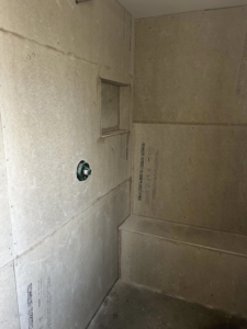Cement backer board installed on shower walls with a niche, ready for waterproofing by G-P Construction in Springfield, OR.