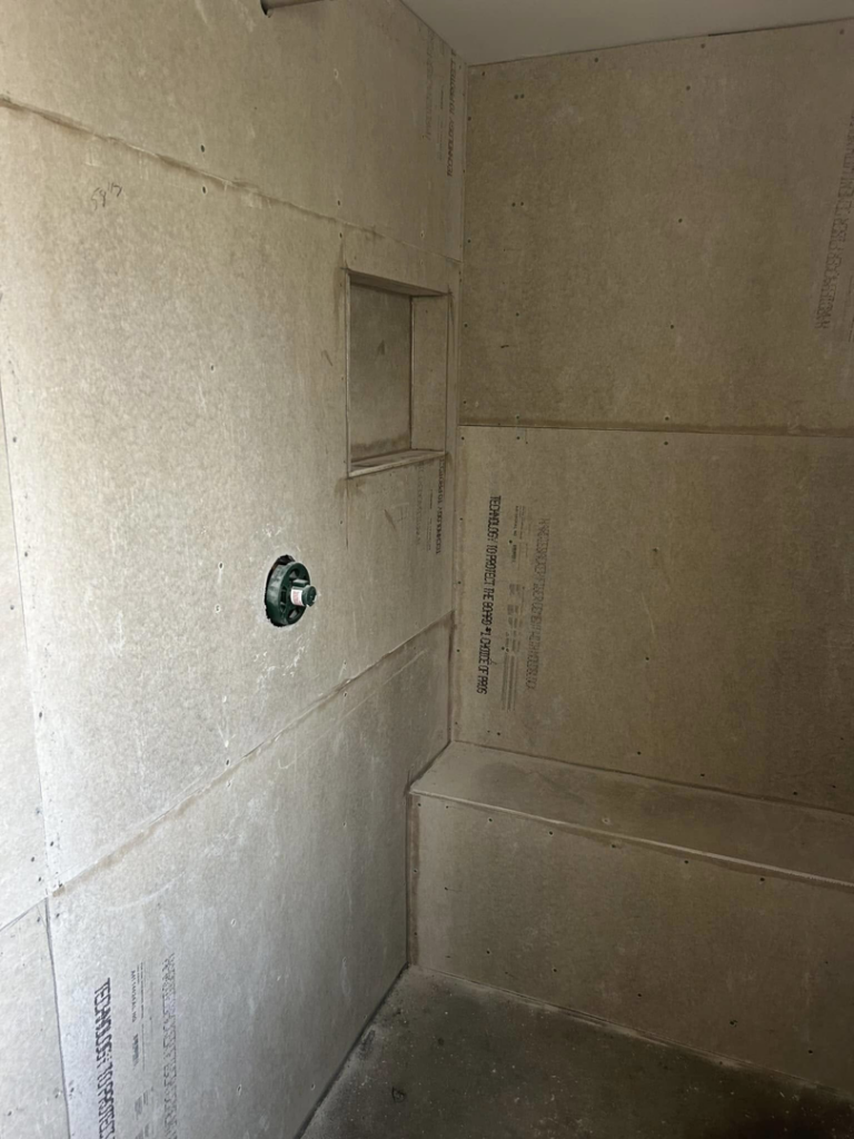 Cement backer board installed on shower walls with a niche, ready for waterproofing by G-P Construction in Springfield, OR.