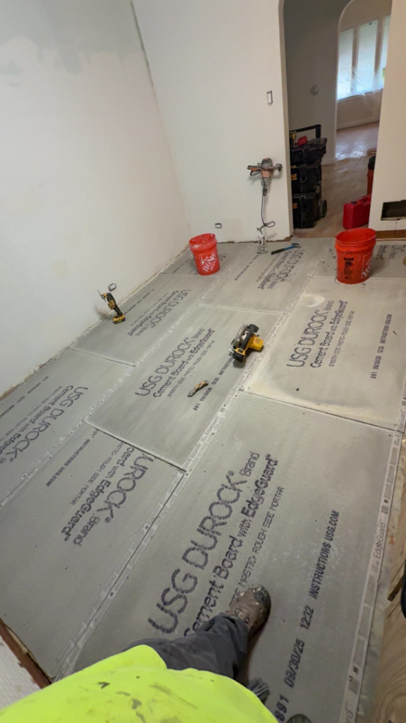 Cement board being installed as subflooring preparation by Rosado Brothers in Chicago, IL