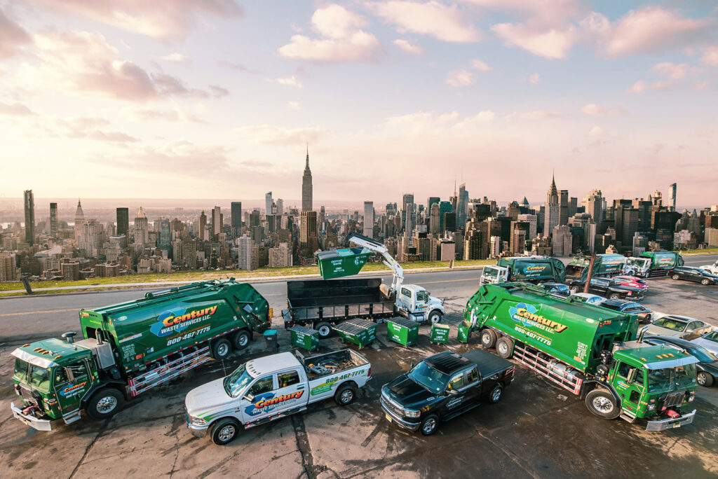 A large fleet of Century Waste Management trucks and dumpsters, representing junk removal services in Sterling Heights, MI.