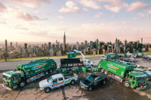 A large fleet of Century Waste Management trucks and dumpsters, representing junk removal services in Sterling Heights, MI.