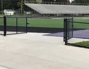 Black chain link fence gates installed at a sports facility by R & C Fence in Fort Wayne, IN.