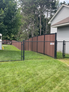 A newly installed chain-link and privacy fence by Cyclone Fence in Somerset, WI.