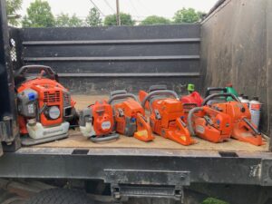 Chainsaws and other essential tree service equipment neatly arranged in a truck for Sky High Tree Service in Lynnwood, WA.