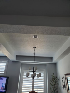 New chandelier and recessed lighting installed in a tray ceiling by IGM Handyman Services in Meridian, ID.