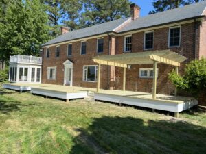A newly installed fence combining chicken wire and wood, completed by Dutch Deck and Fence in Norfolk, VA.