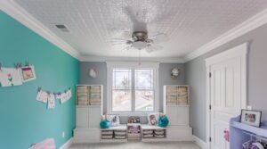 A child's bedroom featuring a newly installed ceiling fan and practical built-in storage, completed by Legacy Builders Group in Cincinnati, OH.