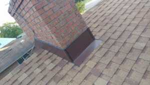 Professional chimney flashing repair and installation on a roof by Xavier Roofing & Remodeling in Dayton, OH.