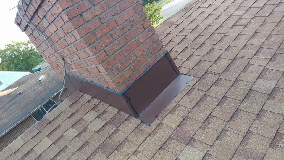 Professional chimney flashing repair and installation on a roof by Xavier Roofing & Remodeling in Dayton, OH.