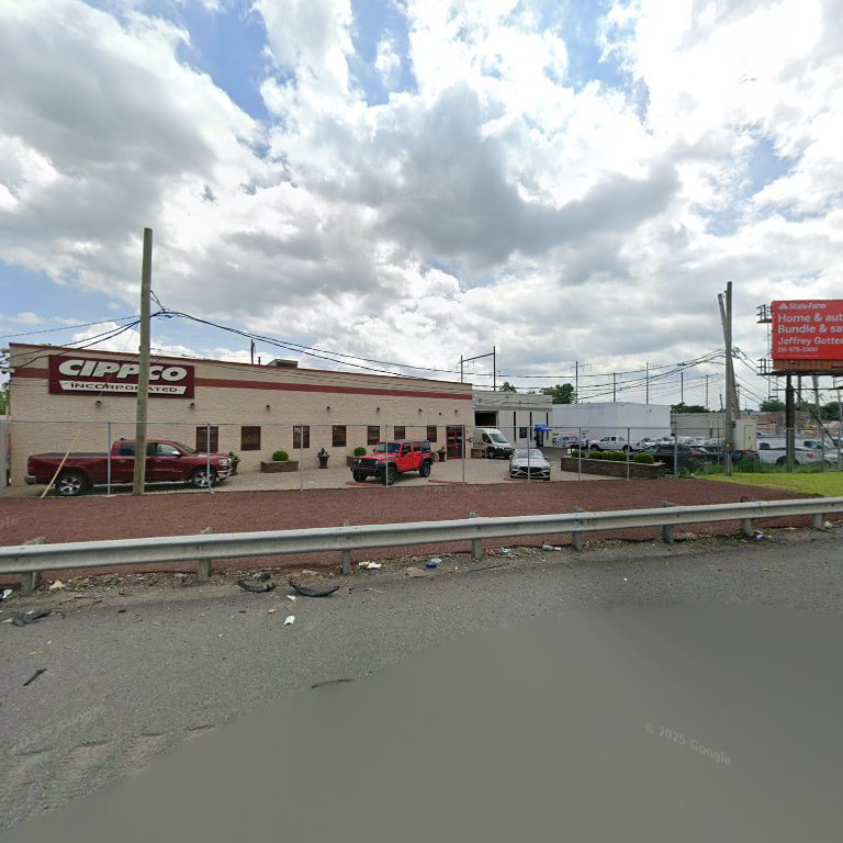 Exterior view of the Cippco Inc. business facility with trucks parked, indicating general contracting operations in Philadelphia, PA.