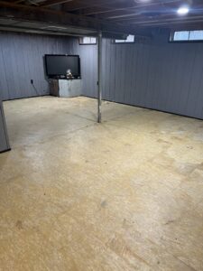 A clean and empty basement after a professional junk removal service by Prestige Junk Removal & Hauling in Detroit, MI.