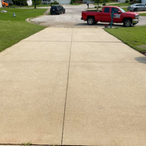 A clean concrete driveway after professional pressure washing by Carter's Handyman Service and Remodeling in Bloomington, IN.