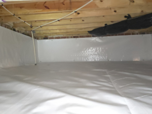 A clean crawlspace with new white vapor barrier installed by Vanco Crawlspace & Restoration in Kittrell, NC.