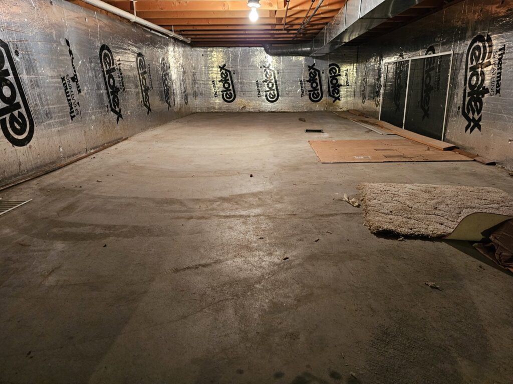 A clean and empty basement after a successful junk removal and cleanout service by T&G Dumping in Lorain, OH.