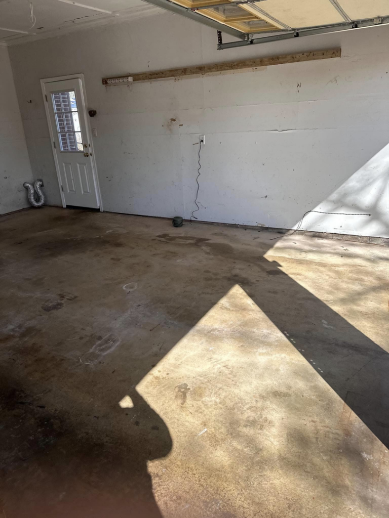 A clean and empty garage, demonstrating a successful junk removal job by 302-Rid-Junk in Wilmington, DE.