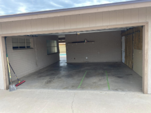 A clean and empty garage after a successful junk removal service by Bin There Junk That in Phoenix, AZ.