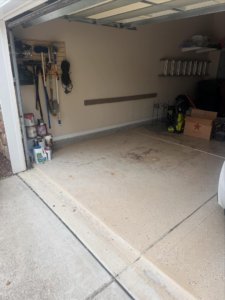 A clean and empty residential garage after a successful junk removal service by Dumpzilla in Raleigh, NC.