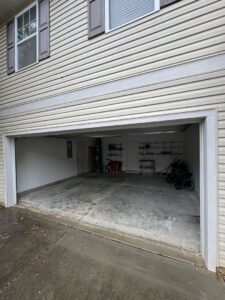A clean and empty garage after a successful junk removal service by Junkjet in Charlotte, NC.