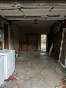 A clean and empty garage after a junk removal service by Rosales Junk Removal in Des Moines, IA.