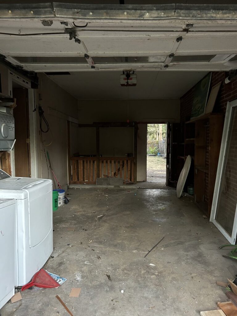 A clean and empty garage after a junk removal service by Rosales Junk Removal in Des Moines, IA.