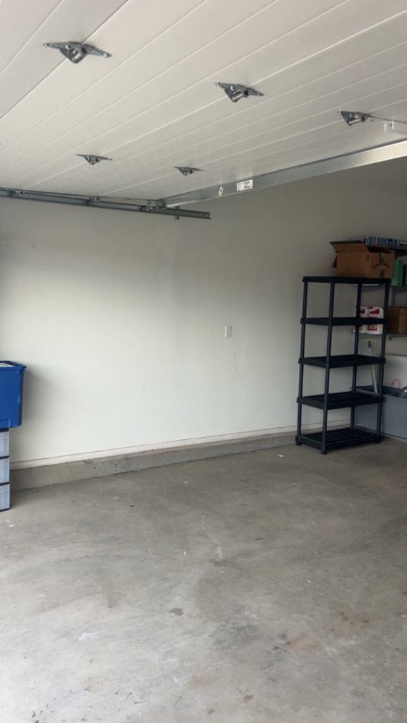 A clean and empty garage space after a successful junk removal service by 575 Junk Removal in Clovis, NM.