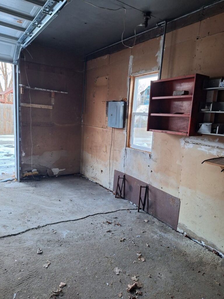 A clean and empty garage after a successful junk removal service by Sunshine junk removal LLC in Lake City, MN.