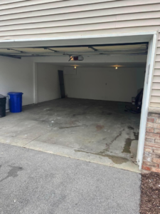 A clean and empty garage after a professional junk removal service by WIY Hauling and Junk removal LLC in Milwaukee, WI.