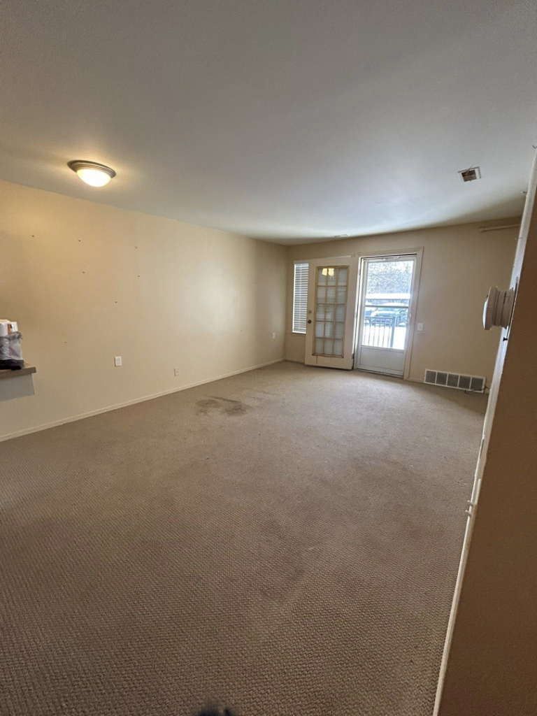 A clean and empty living area after successful junk removal by Big Joe's Junk removal Company LLC in Gibraltar, MI.