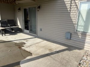 A clean and empty patio area after a junk removal service by Rosales Junk Removal in Des Moines, IA.