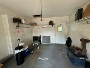 A clean and organized garage after a successful junk removal service by Route Junk in Orlando, FL.