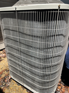 A clean outdoor HVAC condenser unit, serviced by ThermaPros in Leesburg, FL.