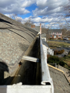 A sparkling clean residential gutter after professional debris removal by DiEduardo Home Services LLC in Edison, NJ.