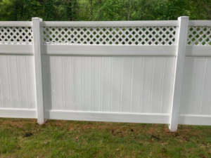 A clean white lattice fence after professional cleaning service by Connecticut Painting Group, Inc in North Haven, CT